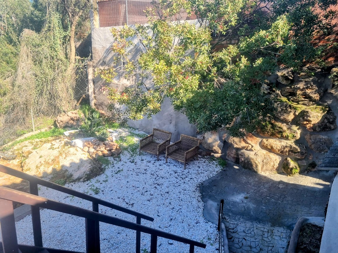 Behind house